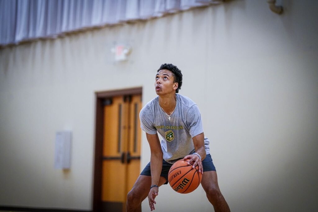 Javon dribbling the basketball during training